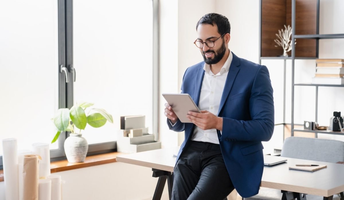 confident-successful-arabian-businessman-tutor-freelancer-ceo-working-on-digital-tablet-min.jpg