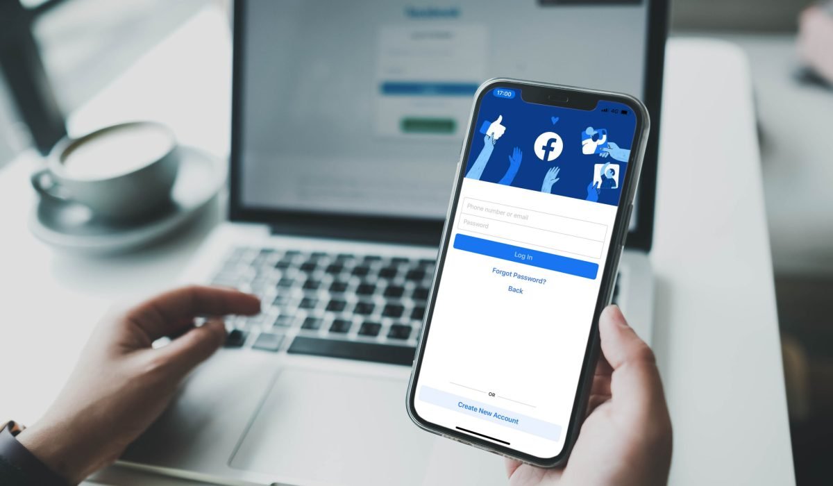 Bangkok. Thailand. JAN 31,2022 :Facebook social media app logo on log-in, sign-up registration page on mobile app screen on iPhone smart devices in business person's hand at work.